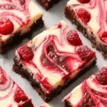 Decadent Raspberry Swirled Brownie Cheesecake Bars