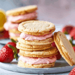 Lemon Sandwich Cookies with Strawberry Frosting