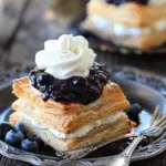 Puff Pastries with Mascarpone Whipped Cream and Blueberry Sauce